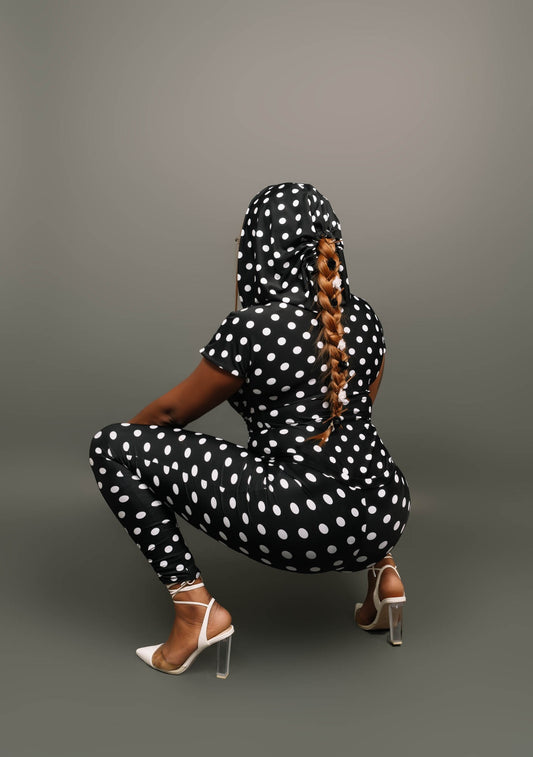 Our stretch black and white polka dot print leggings is a needed splash to your wardrobe. Leggings feature a slim waist band and slight gather at the bottom hem of the legging. Our leggings has stretch and are both sleek and comfortable for any occasion. The leggings are not lined.